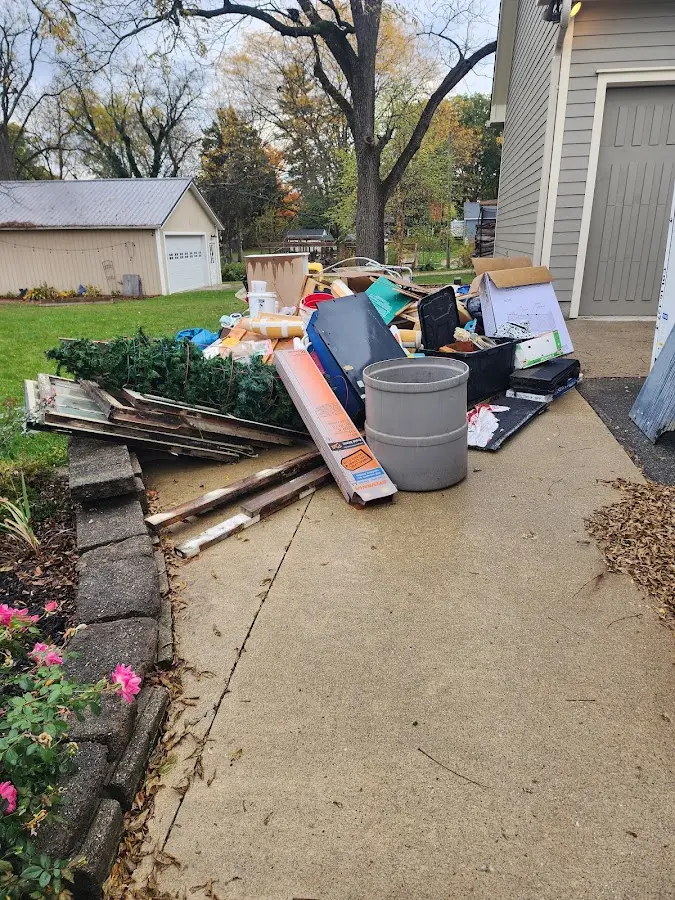 Dumpster being loaded with debris for 3 Yard Dumpster Rental in Windsor